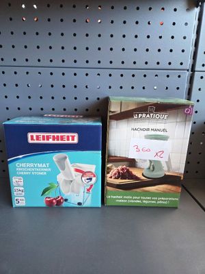 two boxes of food sitting on a shelf in a store