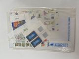 a lot of stamps in a clear bag on the table