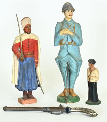 several figurines of men and women are displayed on a white surface