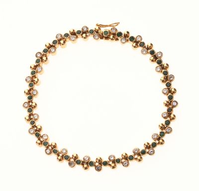 BRACELET en or jaune 750 °/°° orné de diamants et émeraudes …