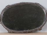 a mirror sitting on top of a wooden table