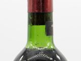 a bottle of wine that is sitting on a table