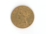 l'image d'une pièce d'or sur laquelle figure une tête de femme
