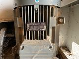 an old electric motor that is sitting on the floor