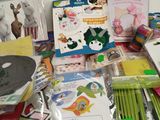 a lot of crafting supplies on the table