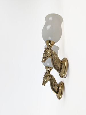 a light that is on the wall next to a lamp