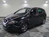 a picture of a black car parked on a checkered floor