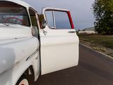a white truck that is parked on the side of the road