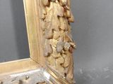 an image of a gold frame sitting on top of a table