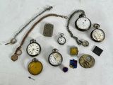 many different types of pocket watches on the table
