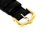 black leather watch strap with gold buckle on a white background