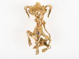an image of a close up of a gold plated animal brooch