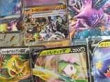 many different types of pokemon cards on the table