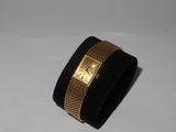 bracelet manchette noir et doré orné d'un carré doré