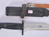 three different types of knives on a white surface