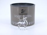 a tin of silver crystal with a horse figurine on it