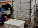 a kitchen with a cart with dishes on top of it