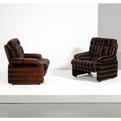 two brown striped chairs sitting on a white surface in a room