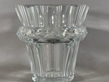 a glass vase that is sitting on a table