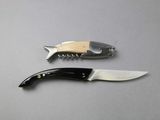 two knives that are sitting next to each other on a table