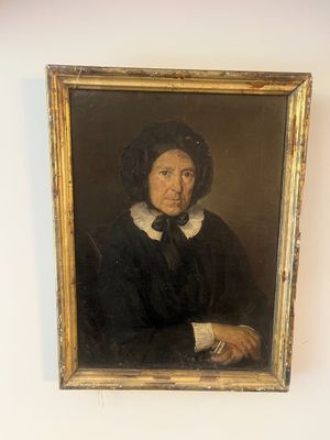 portrait of a man in a black coat with a white collar