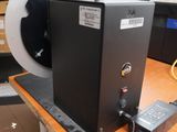 a laptop computer sitting on a table in a room