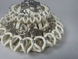 a picture of a white plate with a bunch of rings on it