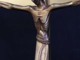statue of jesus on the cross on a black background