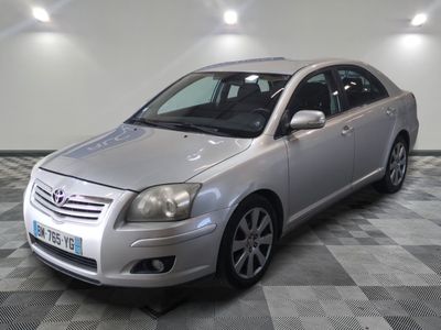 a picture of a silver car parked on a checkered floor