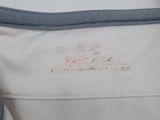 the inside of a white bag with a blue handle