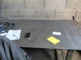 a table with a cell phone on it and papers on the table