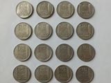 a close up of a bunch of coins sitting on top of a table