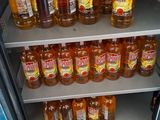 many bottles of alcohol on the shelves in the refrigerator