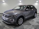a grey volkswagen suv parked in a garage