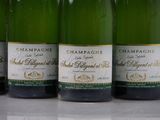 six bottles of champagne are lined up on a table