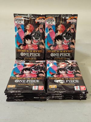 a pile of one piece trading cards sitting on top of each other