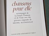 a book opened to show a picture of a wine glass