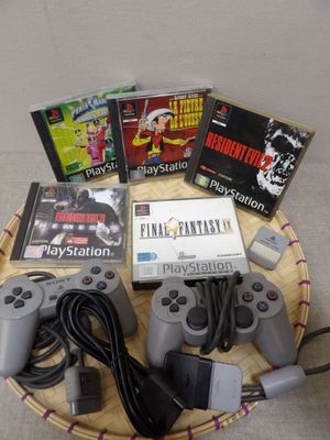 a basket of video games and a game controller on a table