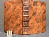 an old book that is sitting on top of a table