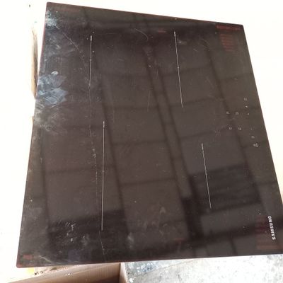 a picture of a black stove top in a box