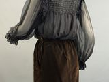 a woman ' s brown skirt and blouse on a mannequin mannequin mannequin mannequin mannequin mannequin mannequin mann
