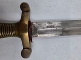 a close up of a knife on a white surface