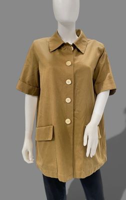 an image of a mannequin wearing a tan jacket and black leggings