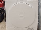 a washing machine and a dryer sitting in a room