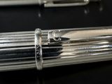 two pens that are sitting on a table
