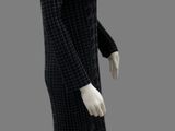 a mannequin dressed in a black and white checkered dress