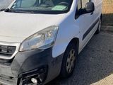 the white van is parked in the parking lot next to the white van