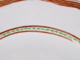 a white plate with a green and red stripe on it