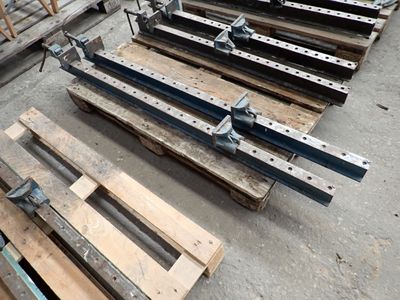 many pieces of wood that are sitting on the ground