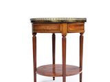 a round table with a marble top and wooden legs